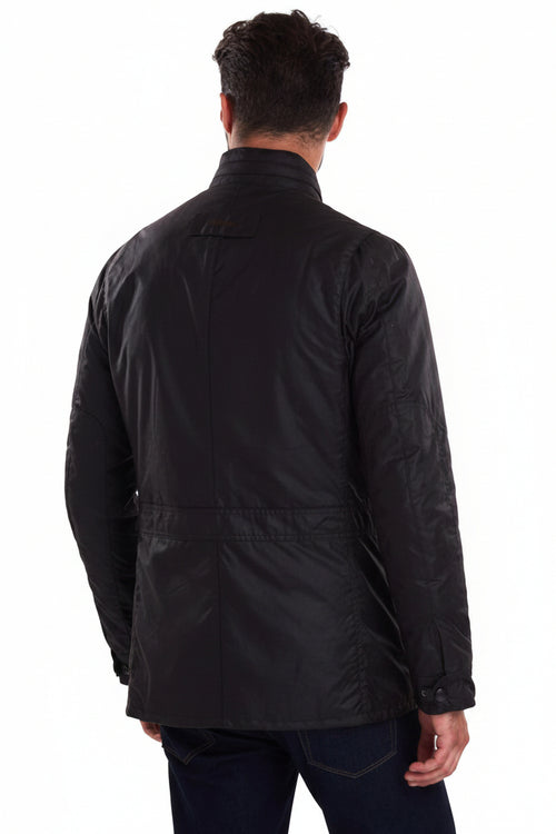 Back view of dark wax jacket with quilted yoke and snap pockets