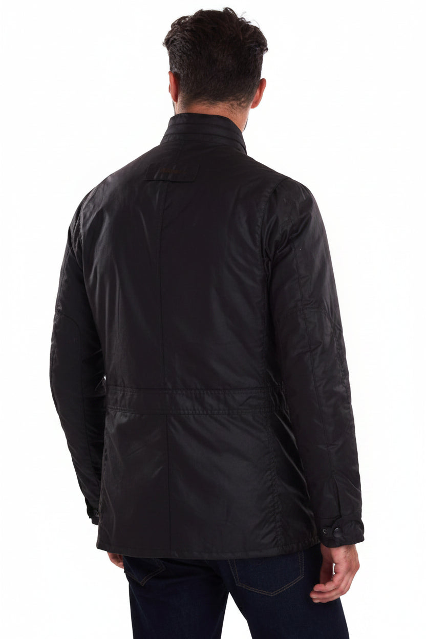 Back view of dark wax jacket with quilted yoke and snap pockets