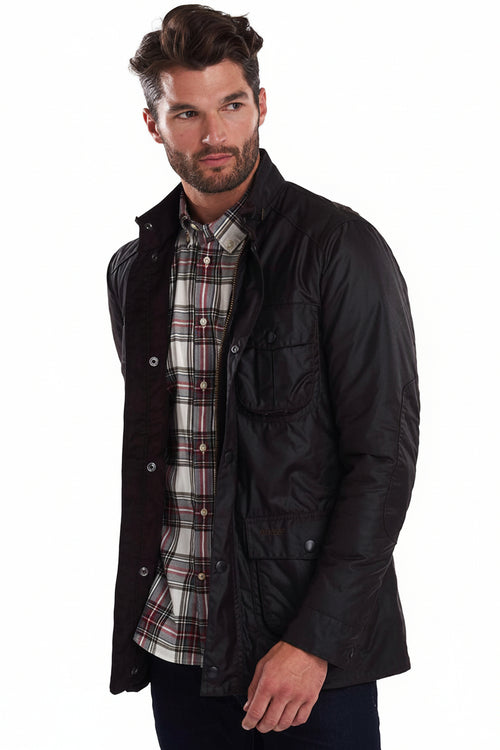 Dark wax jacket with snap pockets and plaid layer at collar