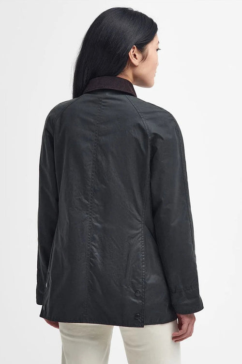Women's black wax Beadnell jacket back view, stand collar, button cuffs