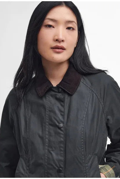 Women's black wax Beadnell jacket front, stand collar, button placket