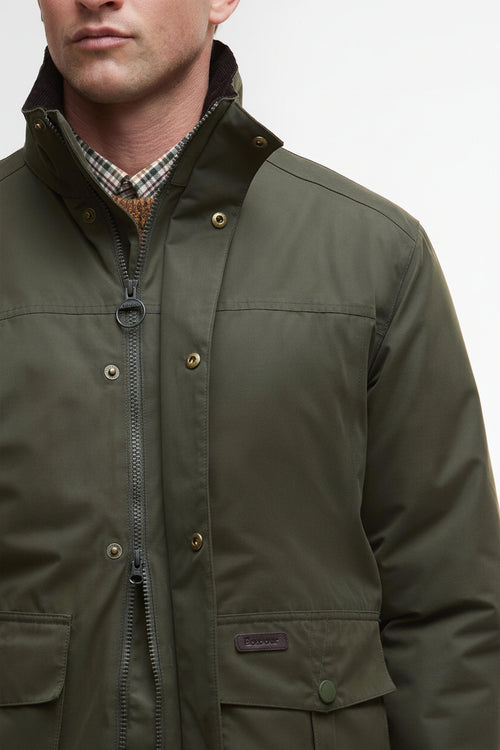 Olive waterproof jacket front close-up with zip placket and chest pocket badge