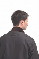 Men's dark brown wax jacket, back view, stand collar and button placket