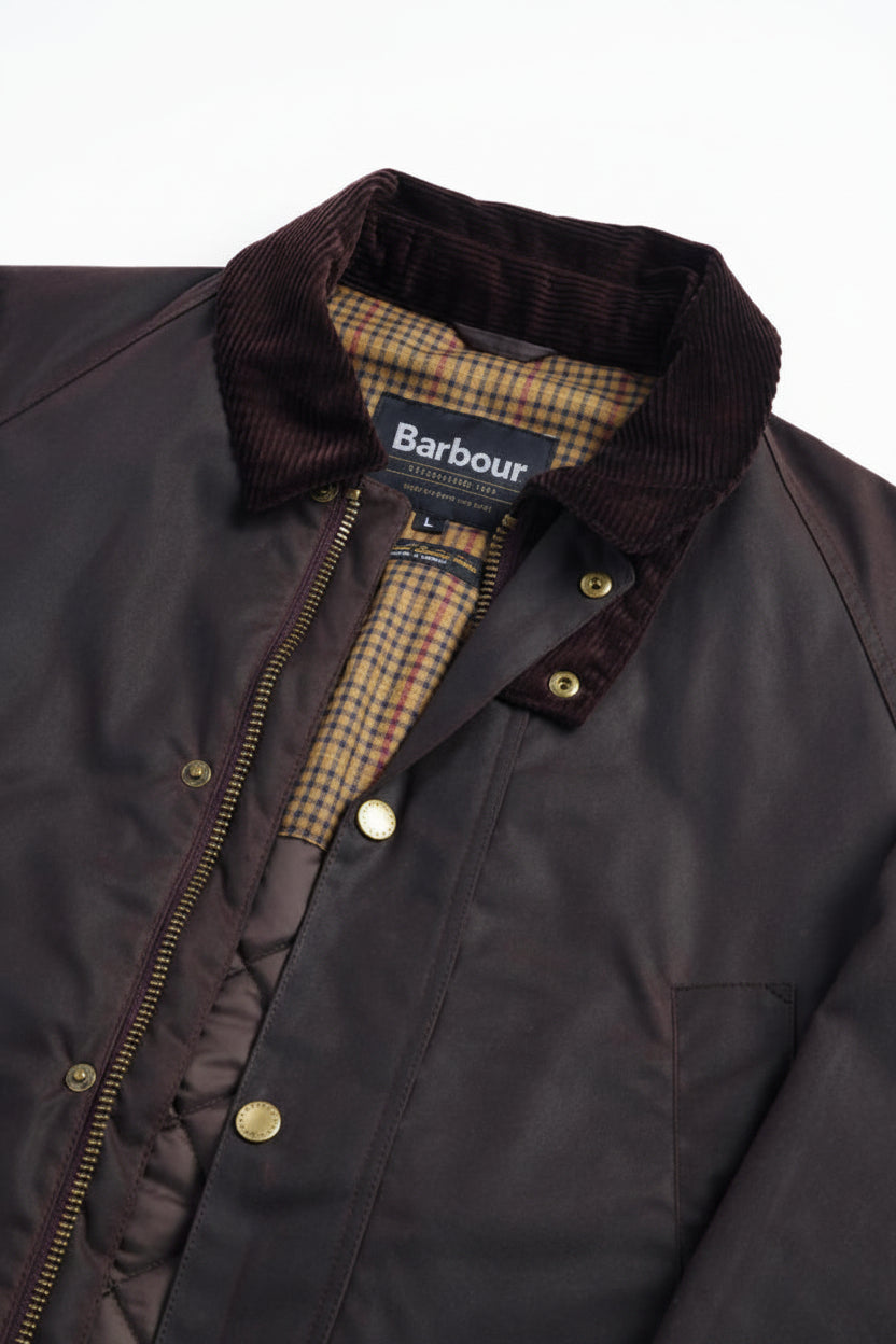Men's wax cotton jacket in dark brown with plaid-lined collar and zip front
