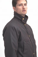 Men's dark brown wax jacket with gold snap buttons and chest pockets