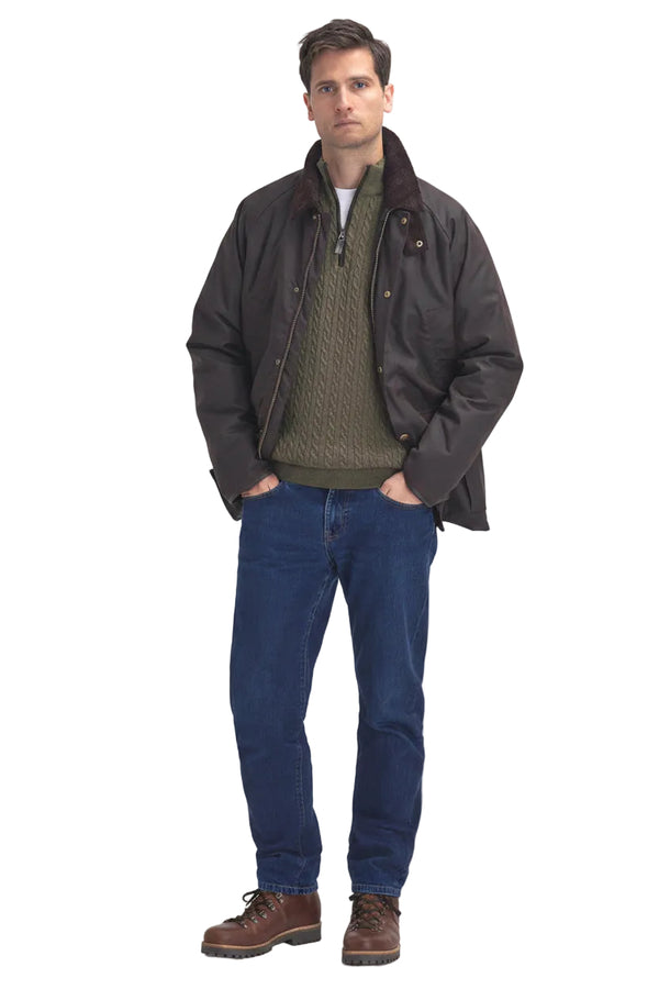 Men's dark brown wax cotton jacket with plaid lining and blue jeans