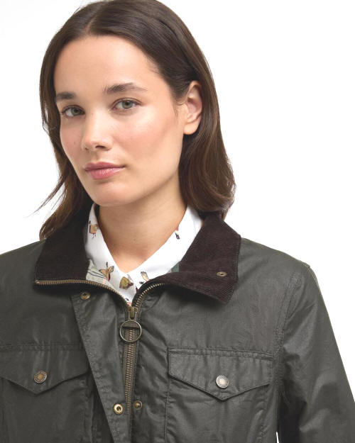 Women's olive waxed jacket with corduroy collar, full-zip front, and snap placket.