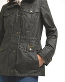 Women's olive waxed jacket with cinched waist, flap pockets, and Barbour logo patch.