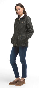 Women's olive waxed jacket with flap pockets, button cuffs, and storm-ready hood.