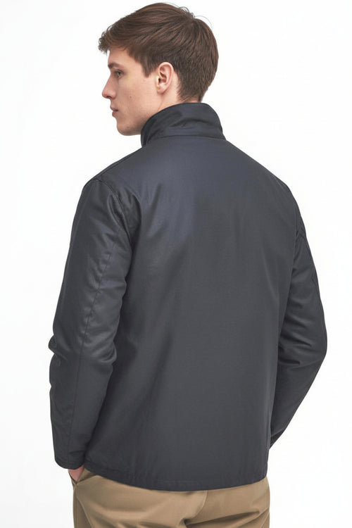 Navy wax jacket back view with stand collar and button closure