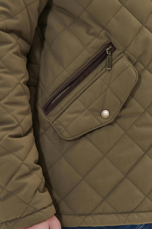 Olive quilted waterproof jacket pocket with zip and snap button detail