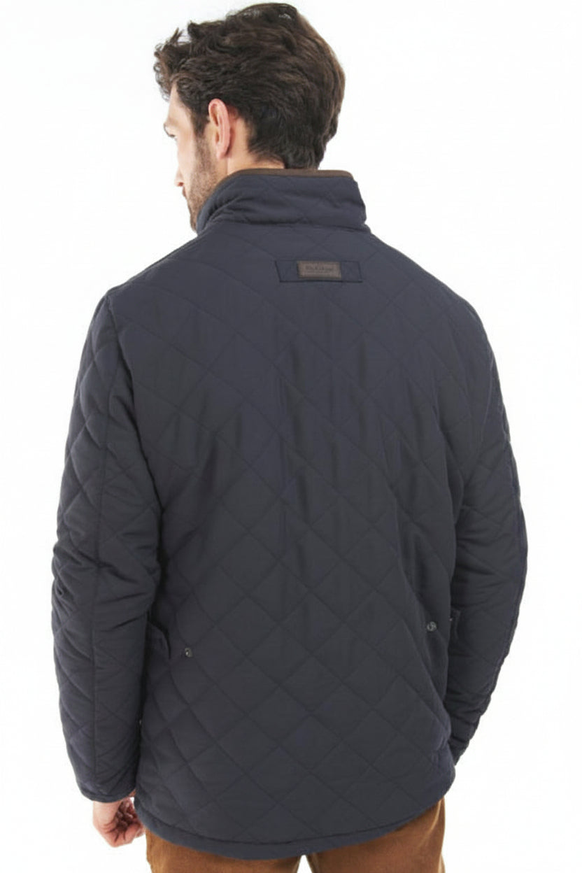 Navy quilted jacket back view with diamond stitching and stand collar
