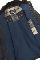 Quilted jacket lining detail with plaid inner collar and Barbour label