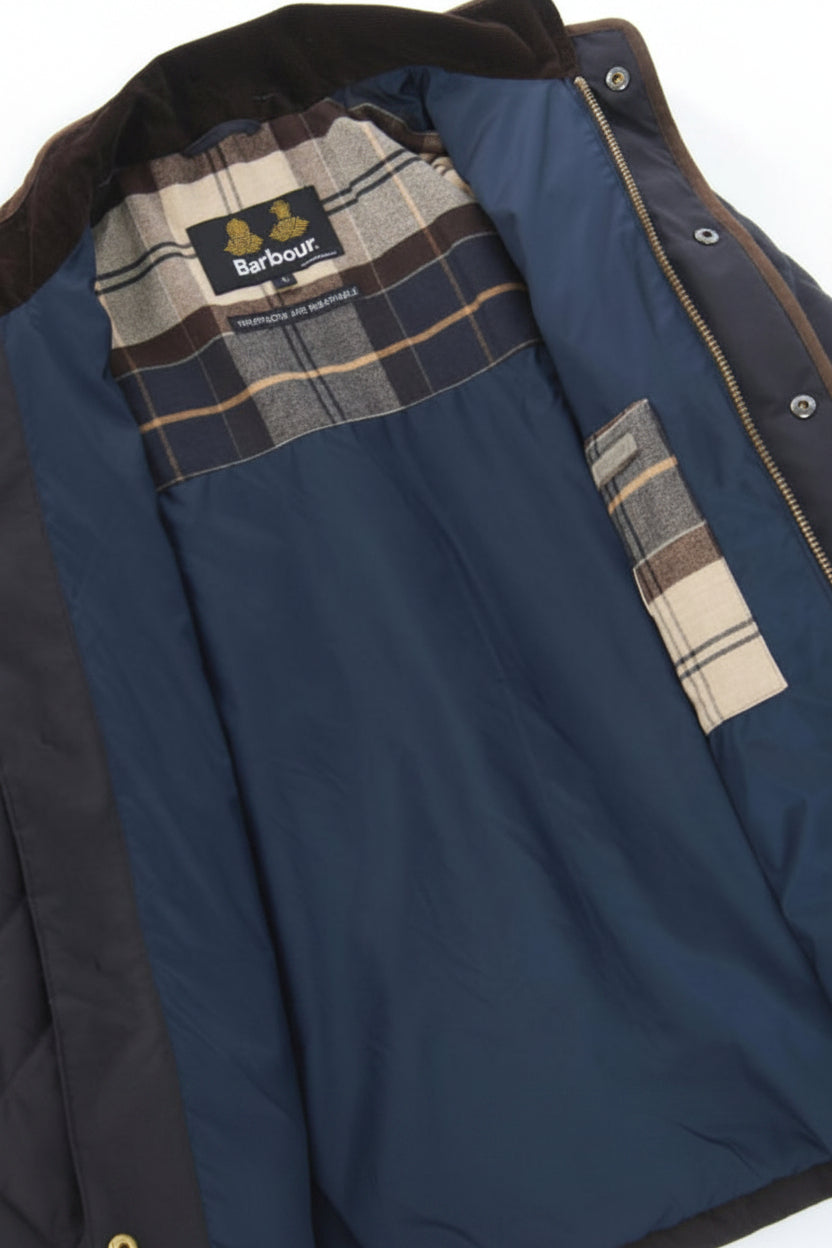 Quilted jacket lining detail with plaid inner collar and Barbour label