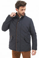Barbour Waterproof Shoveler Quilted Jacket Navy MQU1585NY91 model with diamond pattern, snap buttons, and stand collar