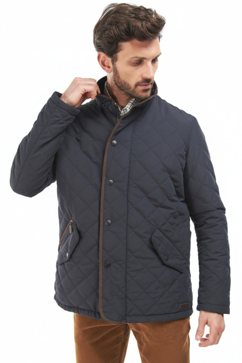 Barbour Waterproof Shoveler Quilted Jacket Navy MQU1585NY91 model with diamond pattern, snap buttons, and stand collar
