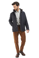 Navy quilted jacket with front snap closure and tartan inner collar