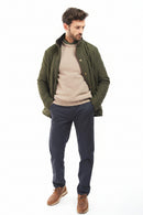 Olive quilted jacket worn open, snap front and side pockets