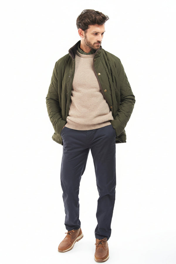 Olive quilted jacket worn open, snap front and side pockets