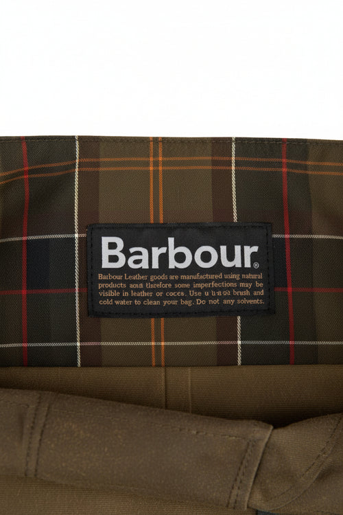 Barbour care label inside waxed Tarras bag lining with plaid fabric panel