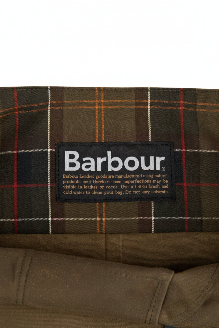 Barbour care label inside waxed Tarras bag lining with plaid fabric panel