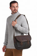 Dark olive Tarras crossbody bag with adjustable shoulder strap, worn by model