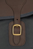 Leather strap keeper with gold-tone buckle on dark navy bag front