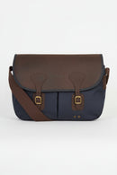 Navy and brown flap messenger bag with leather buckles and front panel seams