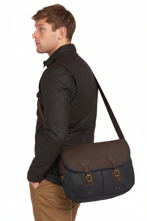 Navy waxed-leather messenger bag with adjustable shoulder strap and flap
