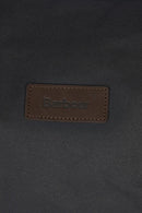 Barbour leather logo patch on dark navy wax holdall bag