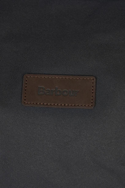 Barbour leather logo patch on dark navy wax holdall bag