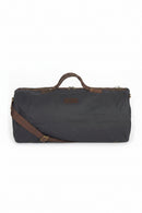 Wax holdall bag in dark navy with leather handles and shoulder strap