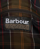 Barbour branded care label on check-lined interior of wax holdall bag