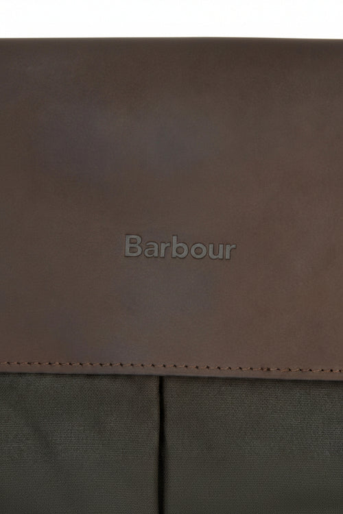 Barbour-embossed leather panel on an olive briefcase with visible edge stitching