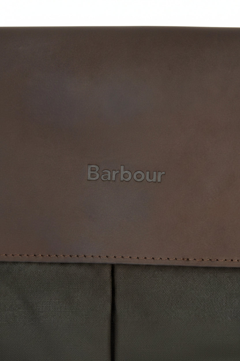 Barbour-embossed leather panel on an olive briefcase with visible edge stitching