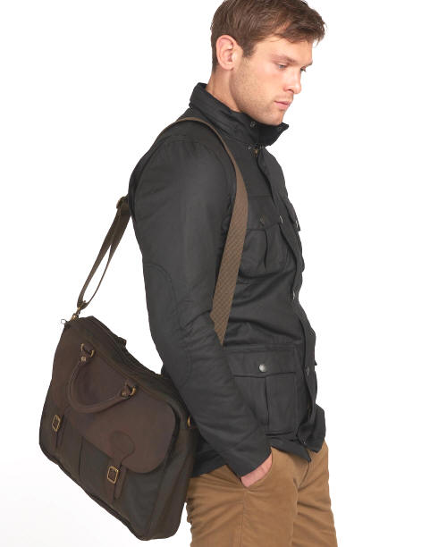 Olive wax leather briefcase worn crossbody with adjustable shoulder strap