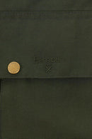 Textured sage green fabric with subtle Barbour logo and crossed emblem patch detail.