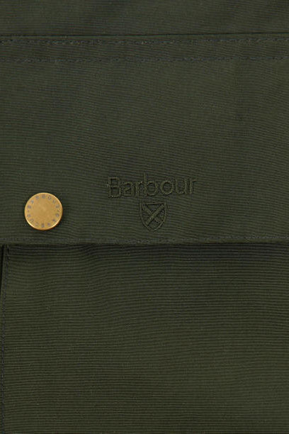 Textured sage green fabric with subtle Barbour logo and crossed emblem patch detail.