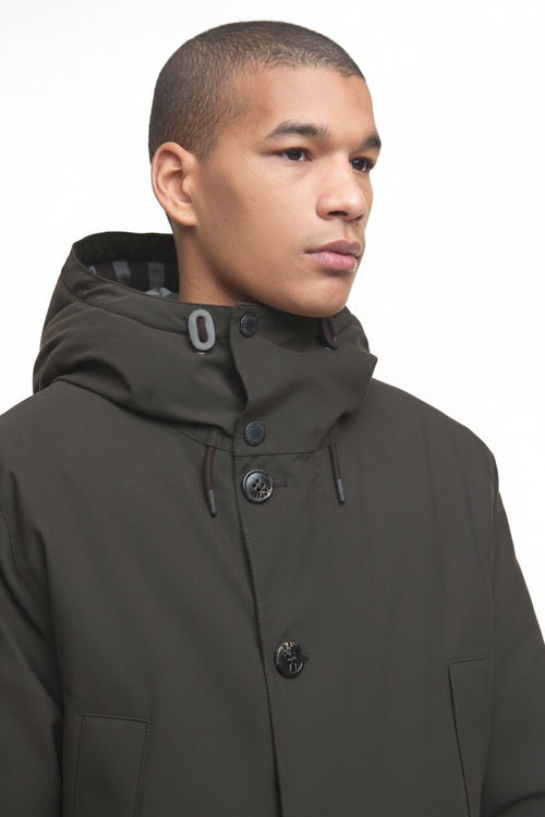 Barbour Beaufort waterproof parka, side view with buttoned high neck and adjustable hood.