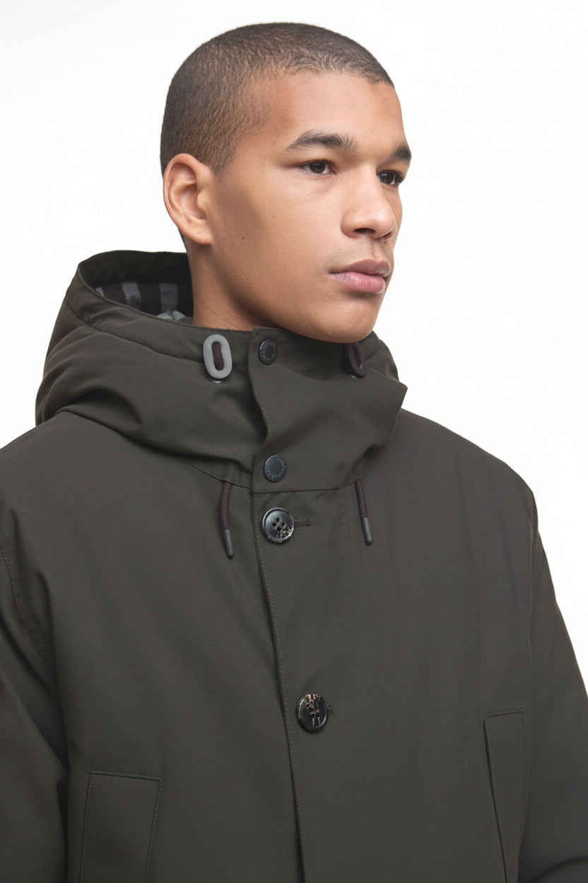 Barbour Beaufort waterproof parka, side view with buttoned high neck and adjustable hood.