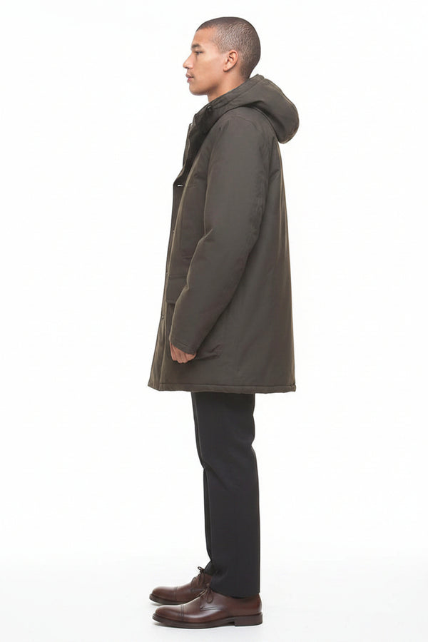 Barbour Beaufort waterproof parka, side profile with long hood and flap pockets, dark olive.