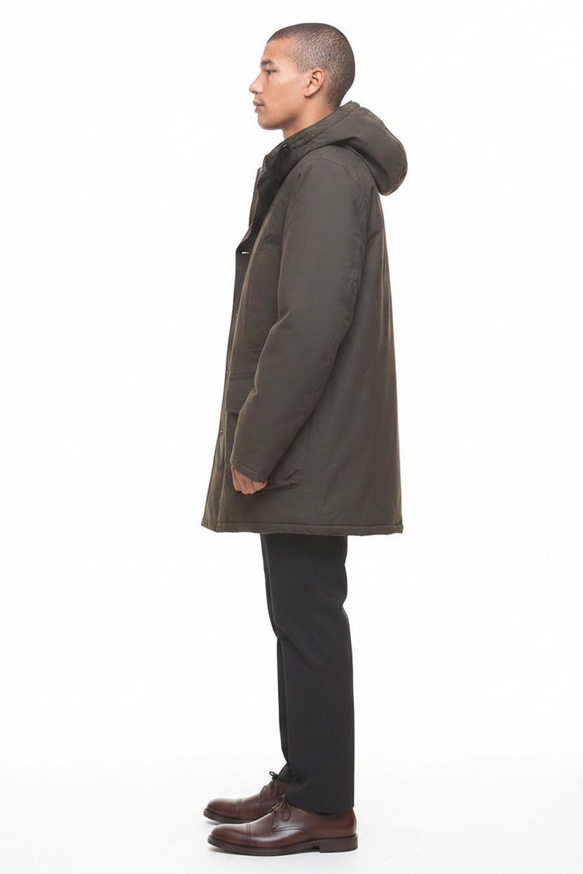 Barbour Beaufort waterproof parka, side profile with long hood and flap pockets, dark olive.