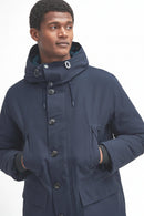 Navy waterproof parka with hood, pockets, and snap-button front detail.