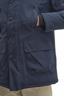 Navy parka with sleeve cuff and front pocket, snap placket, Barbour logo tab.