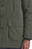 Sage green waterproof parka with snap pockets and chest flap detail