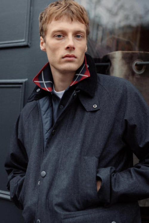 Navy waterproof Bedale jacket with high stand collar, button front, chest pockets
