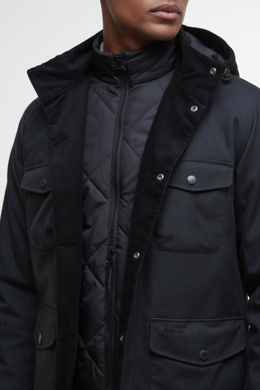 Dark jacket with stand collar, zip front, and flap chest pocket