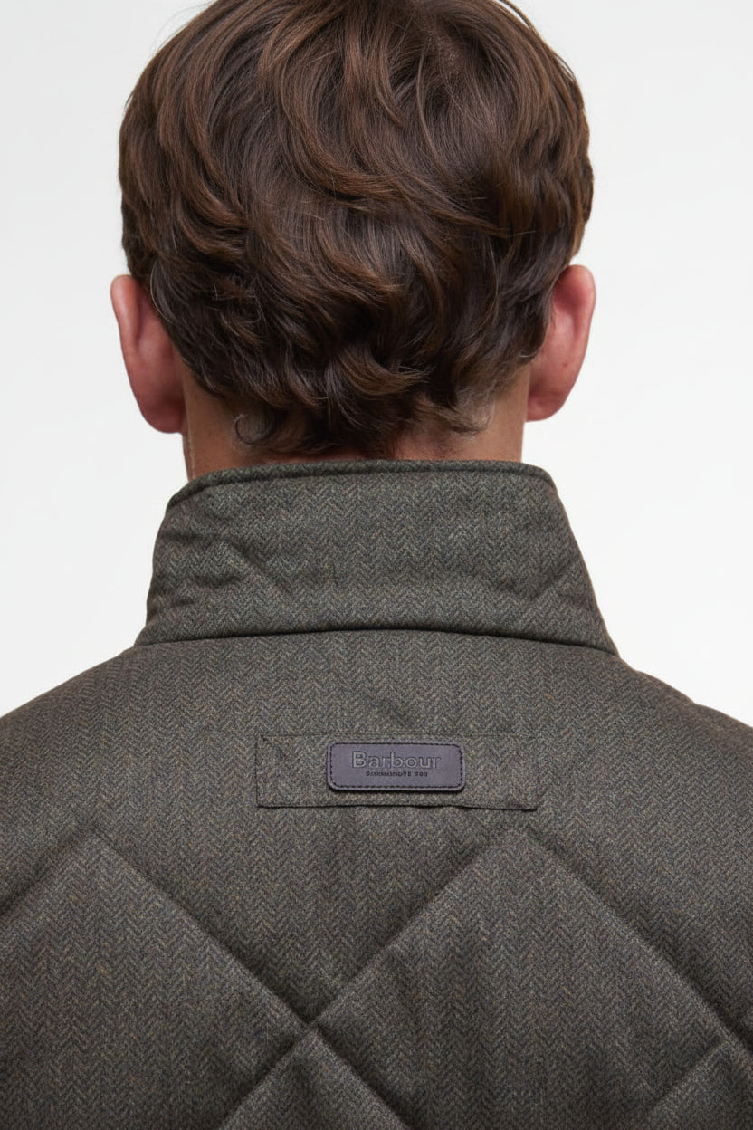 Dark olive quilted jacket back with stand collar and small logo label