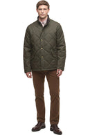 Dark olive quilted winter jacket with button front and side pockets, full outfit view