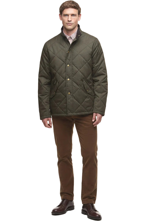 Dark olive quilted winter jacket with button front and side pockets, full outfit view